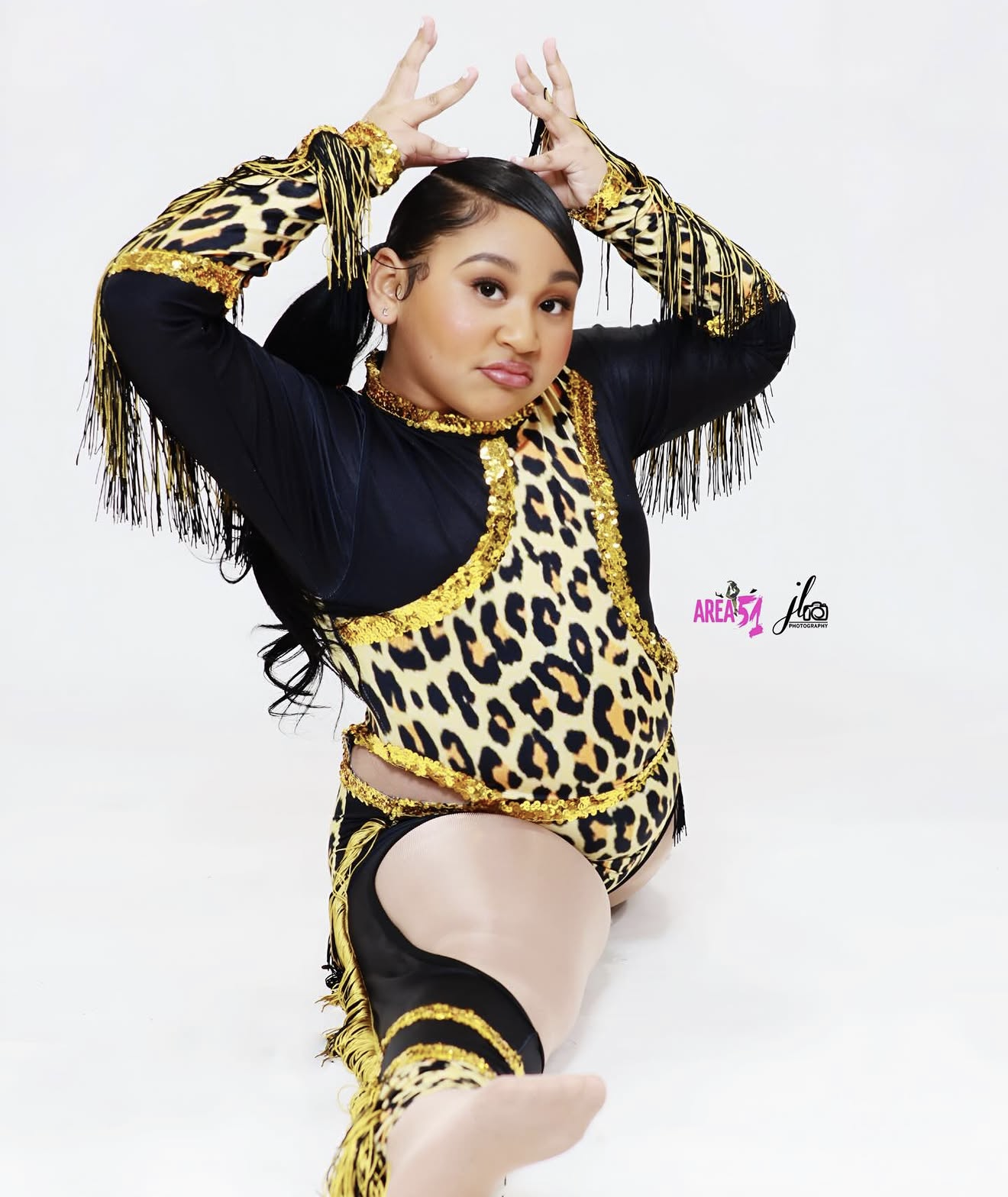 Area 51 dancer in gold leopard-print and fringe costume